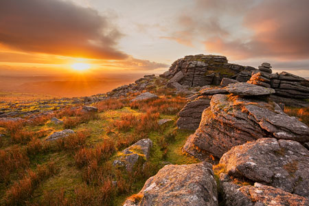 Golden sunlight bathes the land over Kings Tor, Dartmoor